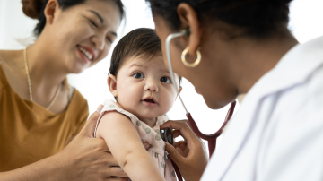 mother and baby visit to the doctor using stethoscope checking heart beat