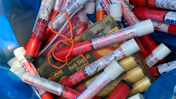 Collection of marine flares in a blue plastic bag