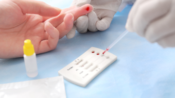 Doctor using test for HIV, Hepatitis B, C and Syphilis close up