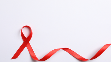 AIDS Awareness Ribbon on white background, space for text.