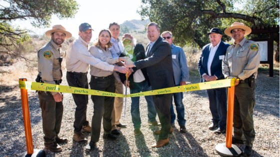Distinguished guests cut the ribbon to commemorate the opening of Gypsum Canyon Wilderness.  From left to right – Supervising Park Ranger II Nick Martinico, OC Parks; President & Chief Executive Officer Michael O’Connell, Irvine Ranch Conservancy; Director Pam Passow, OC Parks; Chairman Donald P. Wagner, Orange County Board of Supervisors; Vice Chair Bert Ashland, OC Parks Commission; Vice President Mark Denny, Irvine Company; Vice President Dean Kirk, Irvine Company; Senior Vice President Bill Martin, Irvi