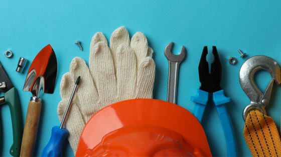 many different types of construction tools laid out on a blue background