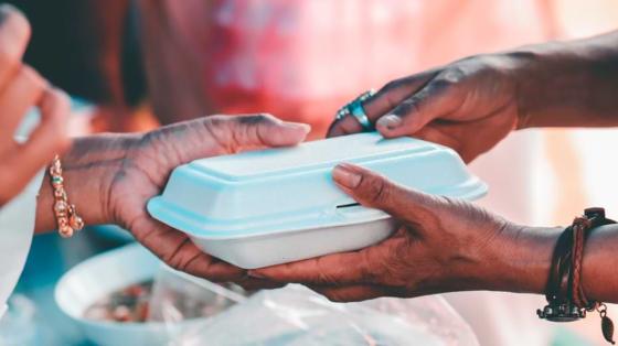 picture of handing food to a community member