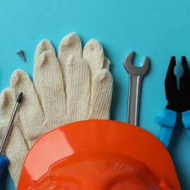 many different types of construction tools laid out on a blue background