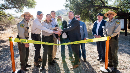 Distinguished guests cut the ribbon to commemorate the opening of Gypsum Canyon Wilderness.  From left to right – Supervising Park Ranger II Nick Martinico, OC Parks; President & Chief Executive Officer Michael O’Connell, Irvine Ranch Conservancy; Director Pam Passow, OC Parks; Chairman Donald P. Wagner, Orange County Board of Supervisors; Vice Chair Bert Ashland, OC Parks Commission; Vice President Mark Denny, Irvine Company; Vice President Dean Kirk, Irvine Company; Senior Vice President Bill Martin, Irvi