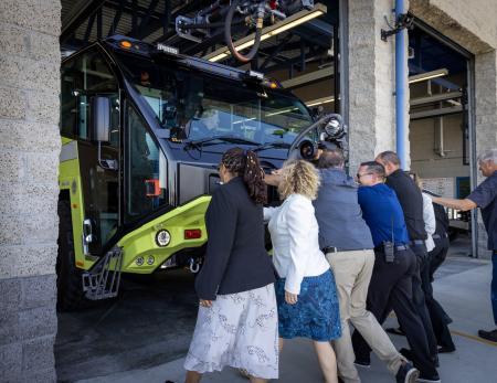 John Wayne Airport Director Charlene Reynolds, Orange County Supervisor Katrina Foley and members from the Orange County Fire Authority (OCFA) enter the OCFA Fire Station 33 to inspect a new Crash 3 Vehicle